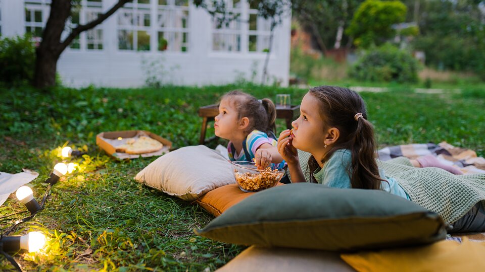 girls watching movie night at backyard together a 2023 11 27 05 05 43 utc